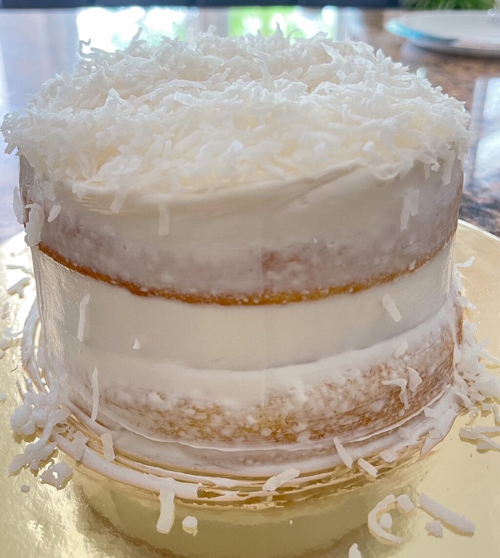 semi bare cake with shredded coconut