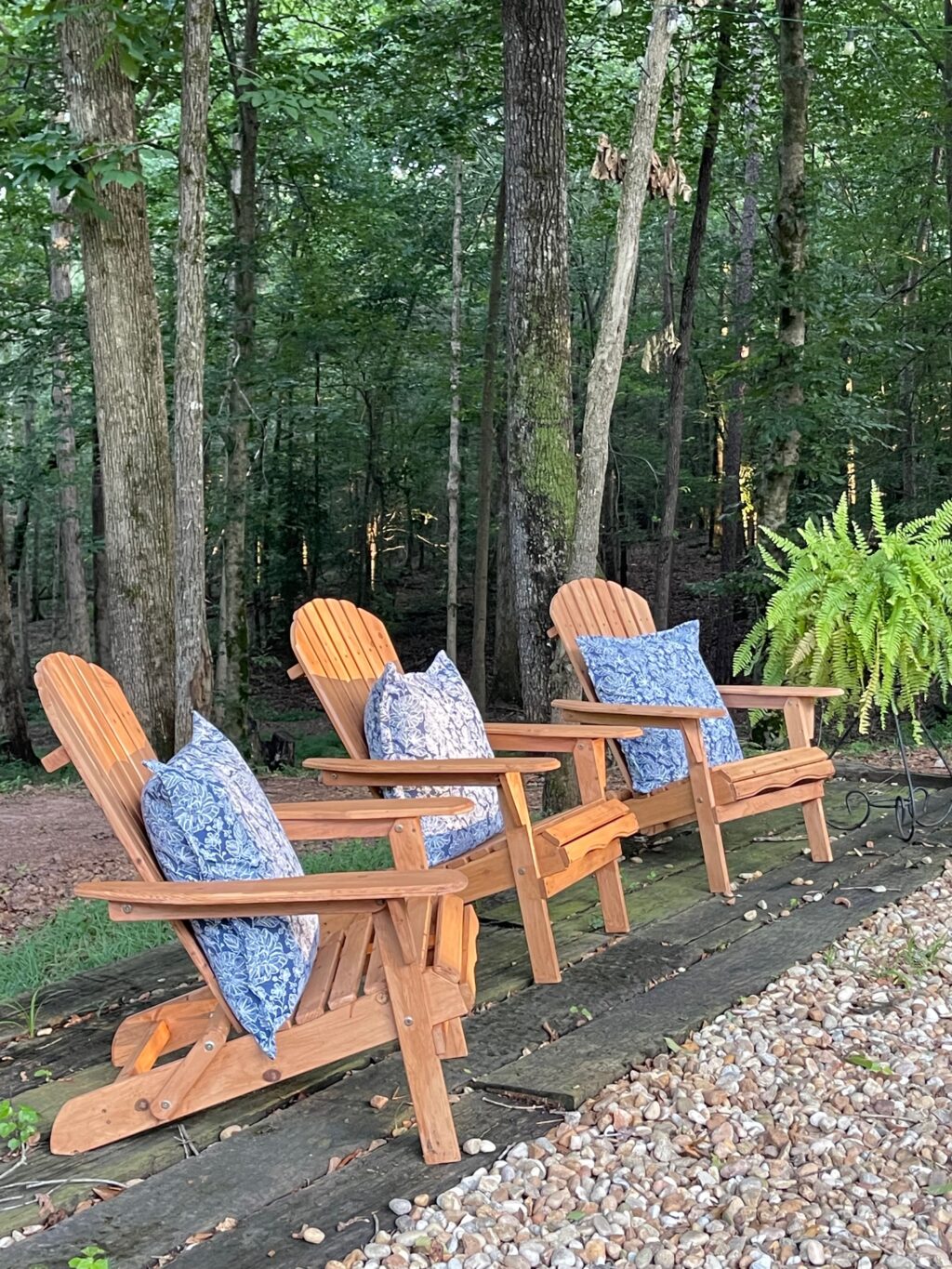 adrindack chairs with blue pillows