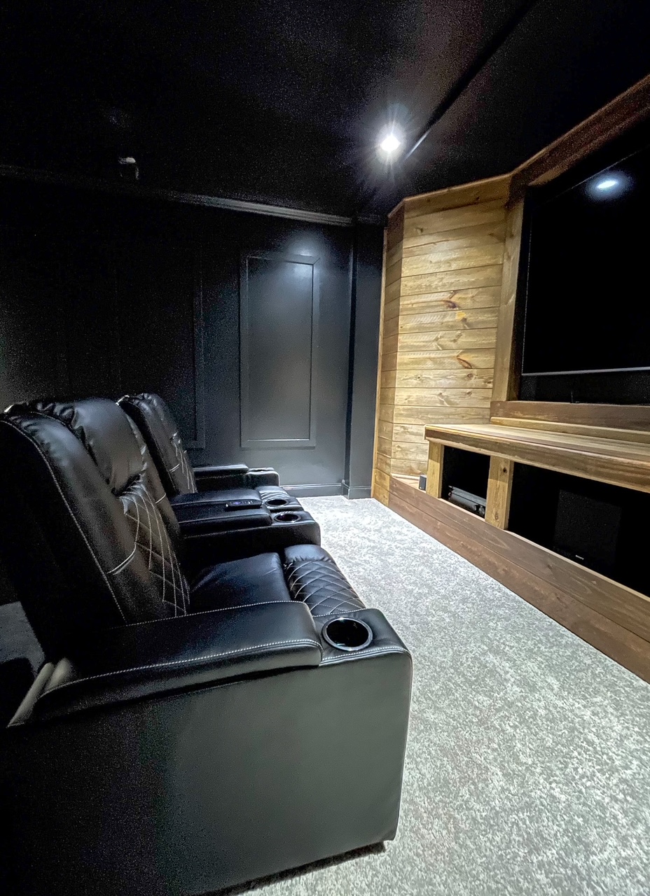 movie room with black walls