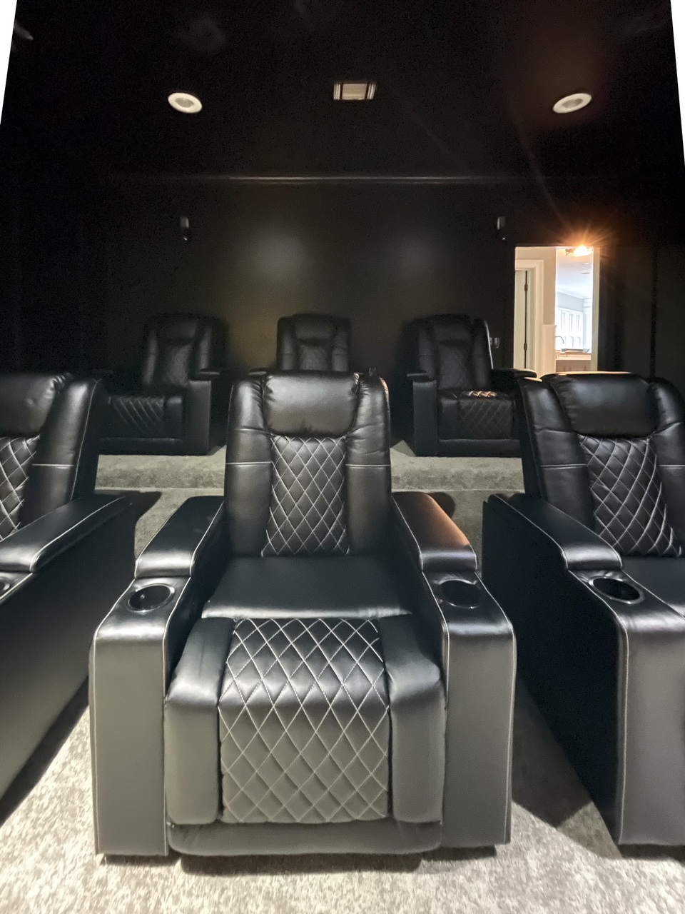 front view of black chairs in modern media room