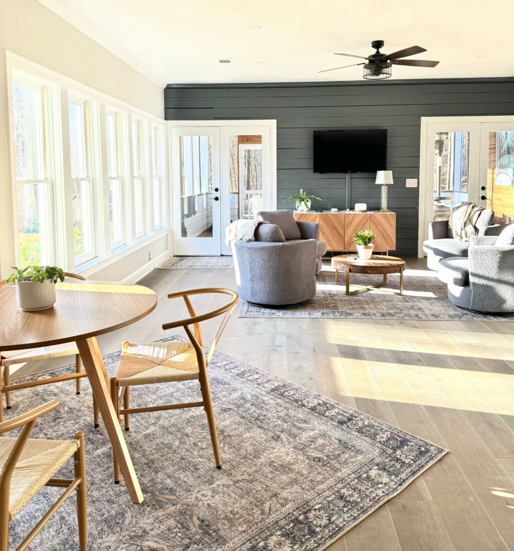 full shot of bright room with chairs and table