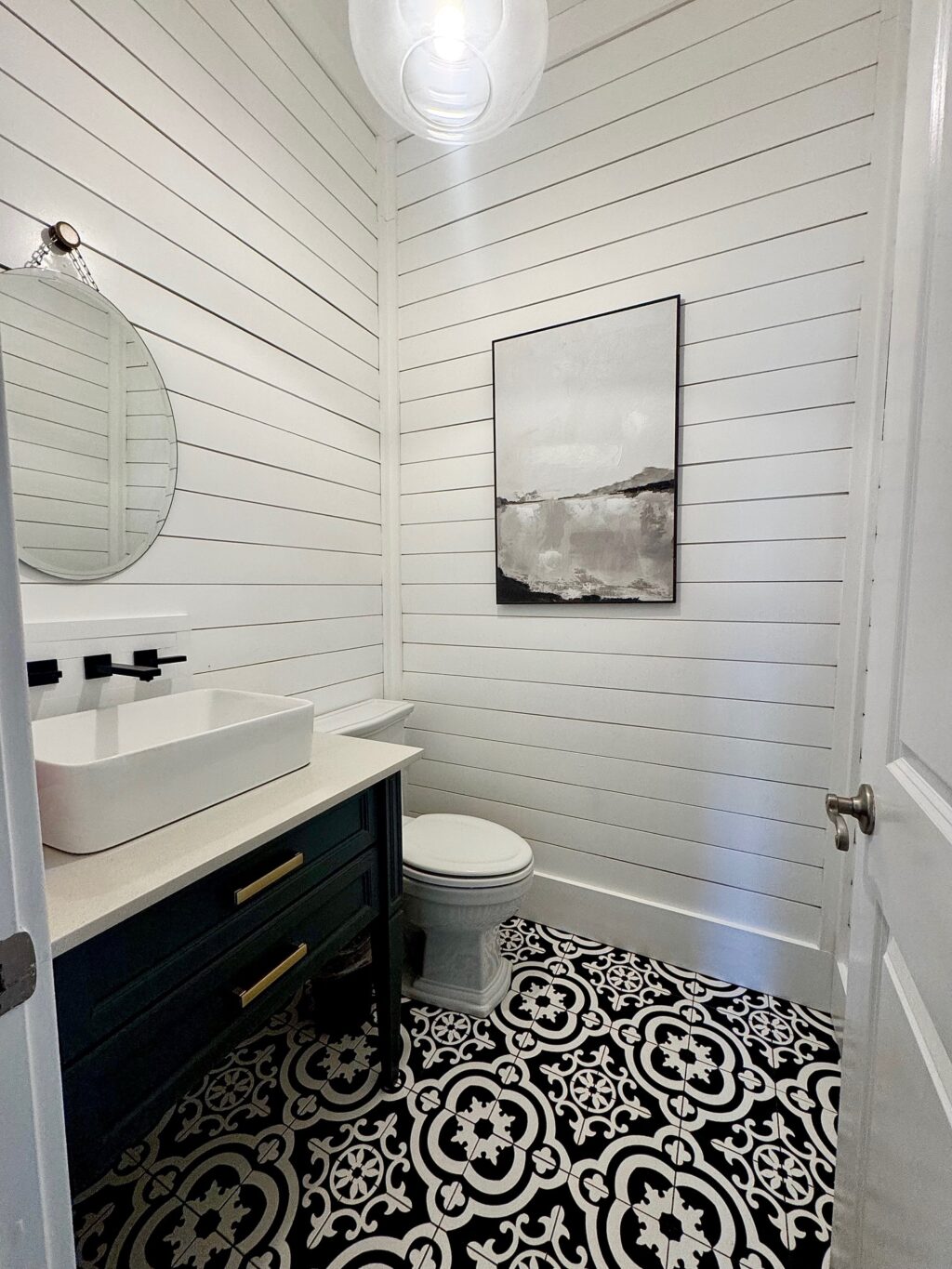 DIY shiplap access panel on wall in bathroom