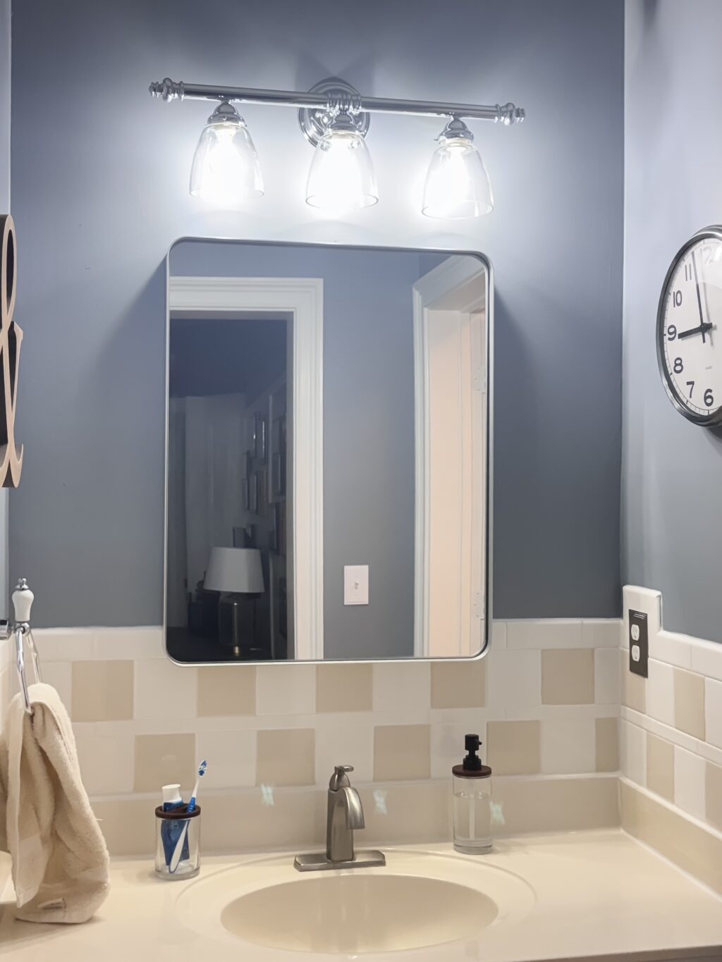bathroom vanity area and silver mirror included in weekend hangout at Duke Manor Farm
