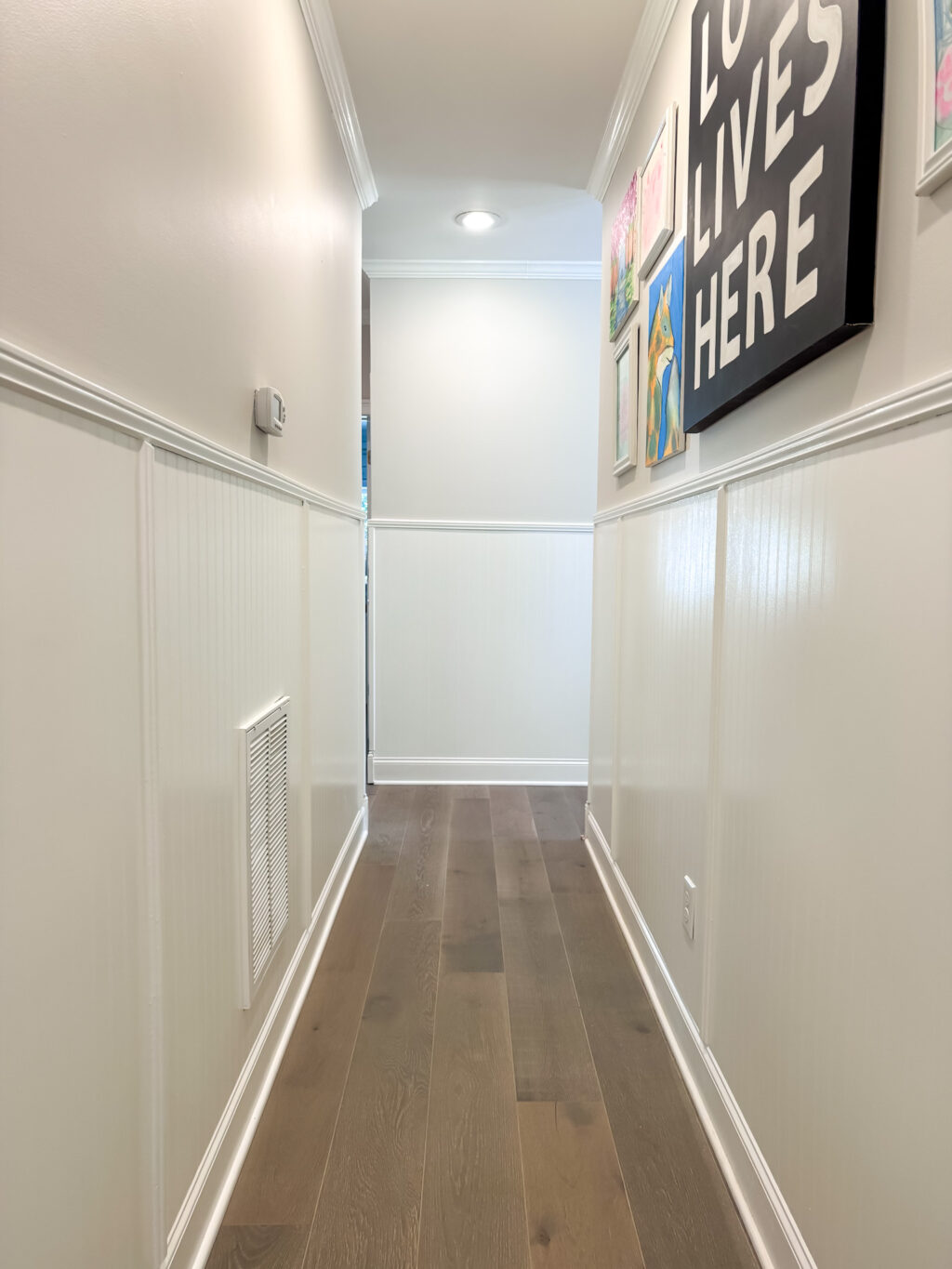 long hallway with gallery wall