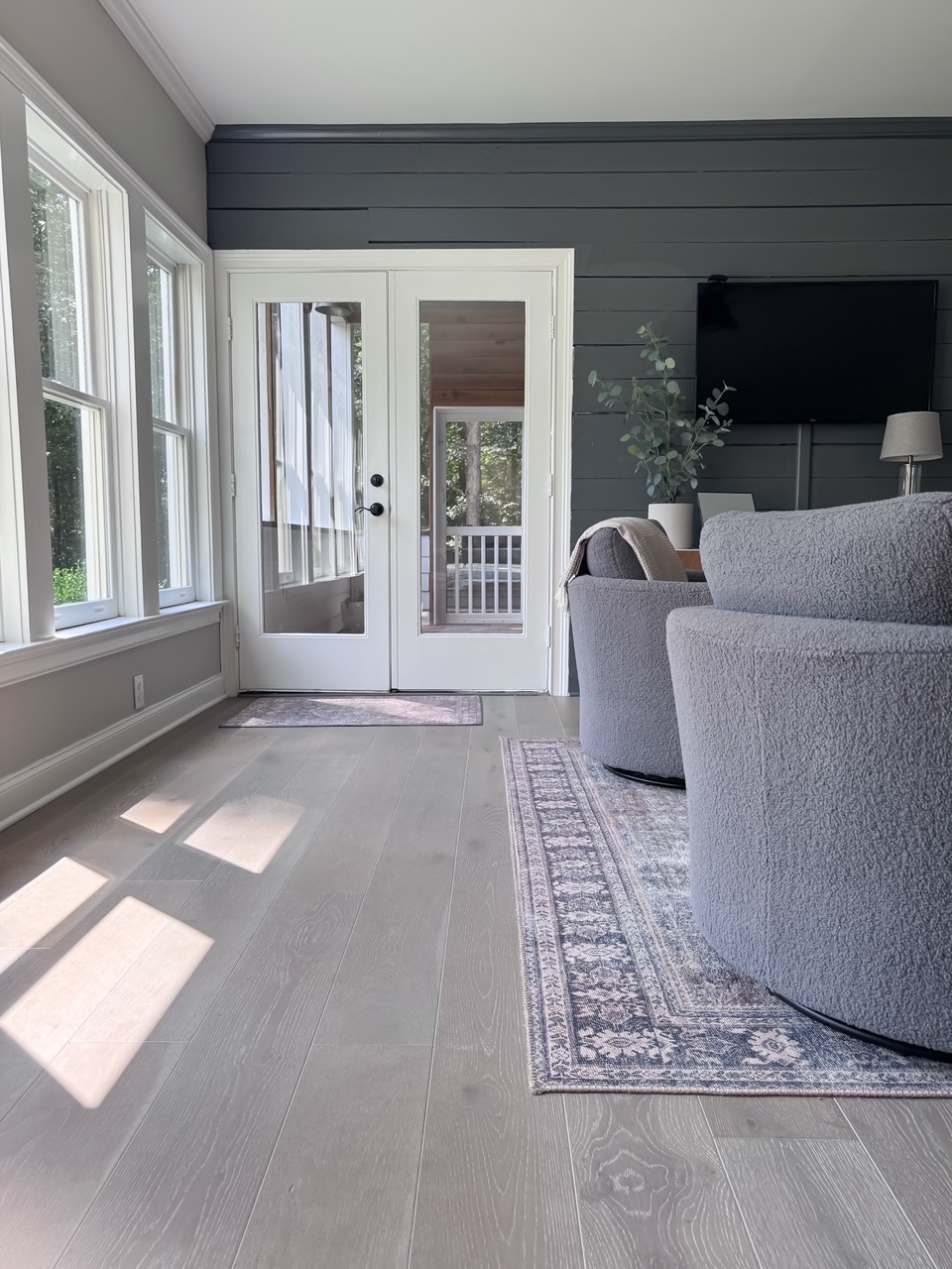 gray club chairs in game room on top of waterproof hardware flooring