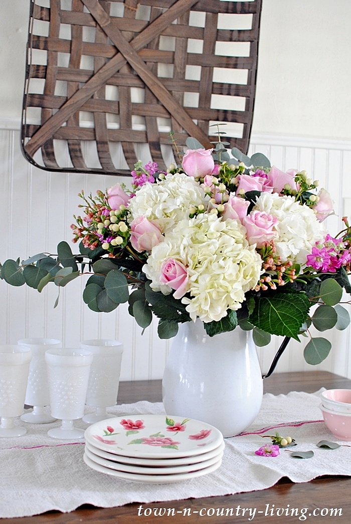 spring flower arrangement in vintage vase