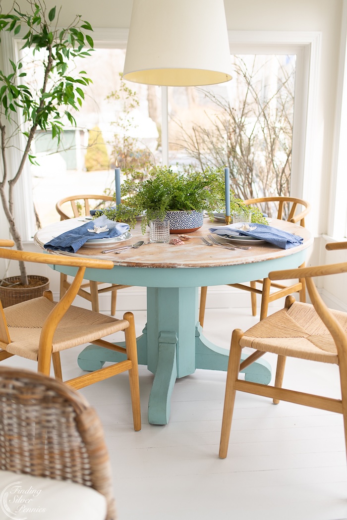spring dining room styled with soft linens and fresh floral centerpiece