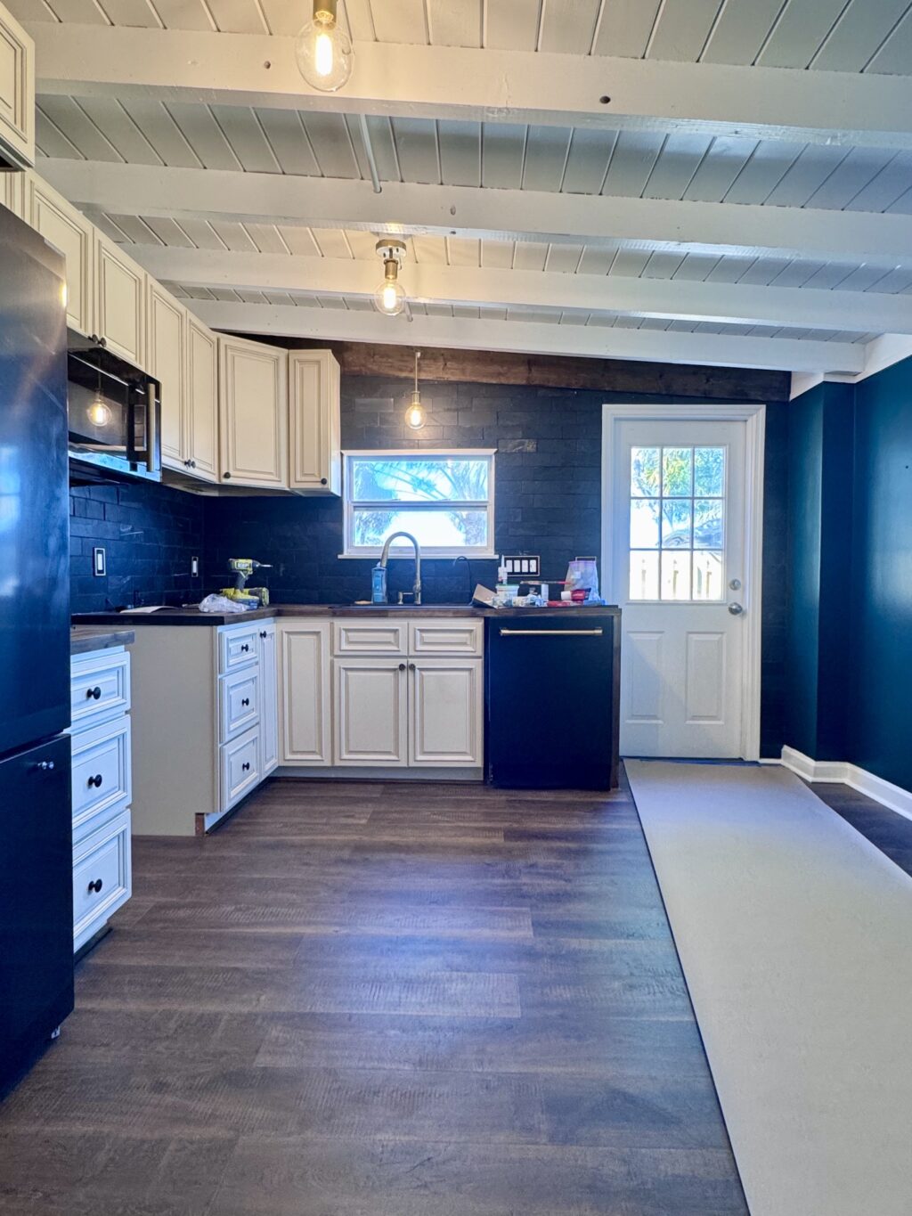 1950s cottage kitchen after remodel with butcher block counters