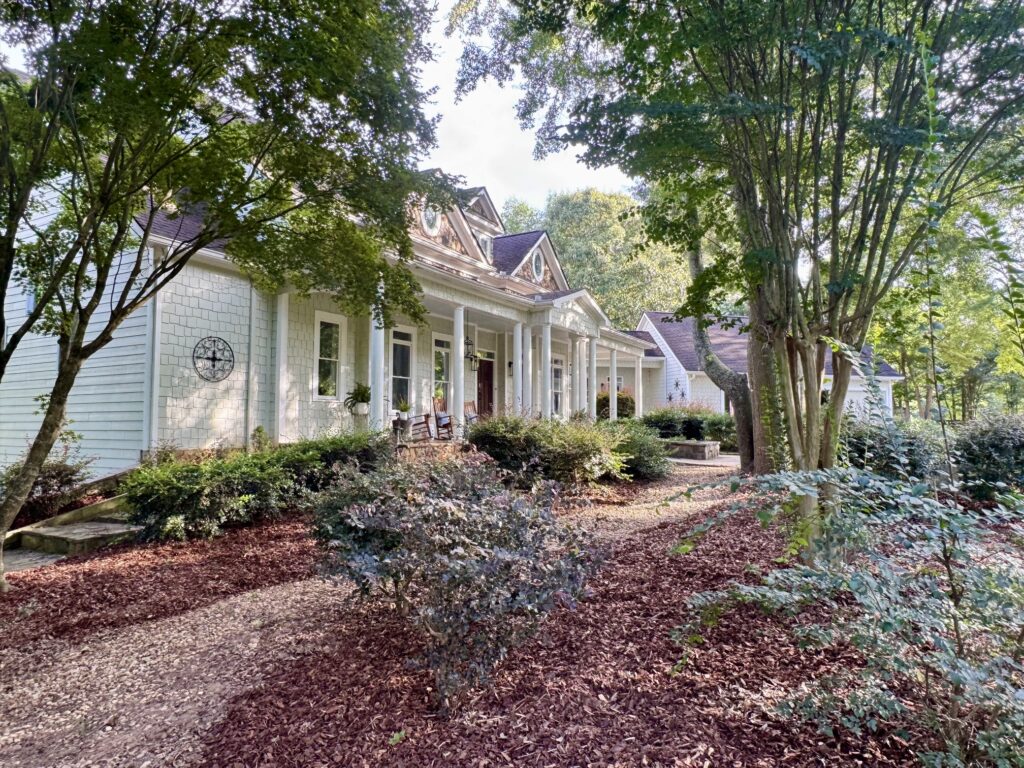 Front porch and landscape at Duke Manor Farm in summer