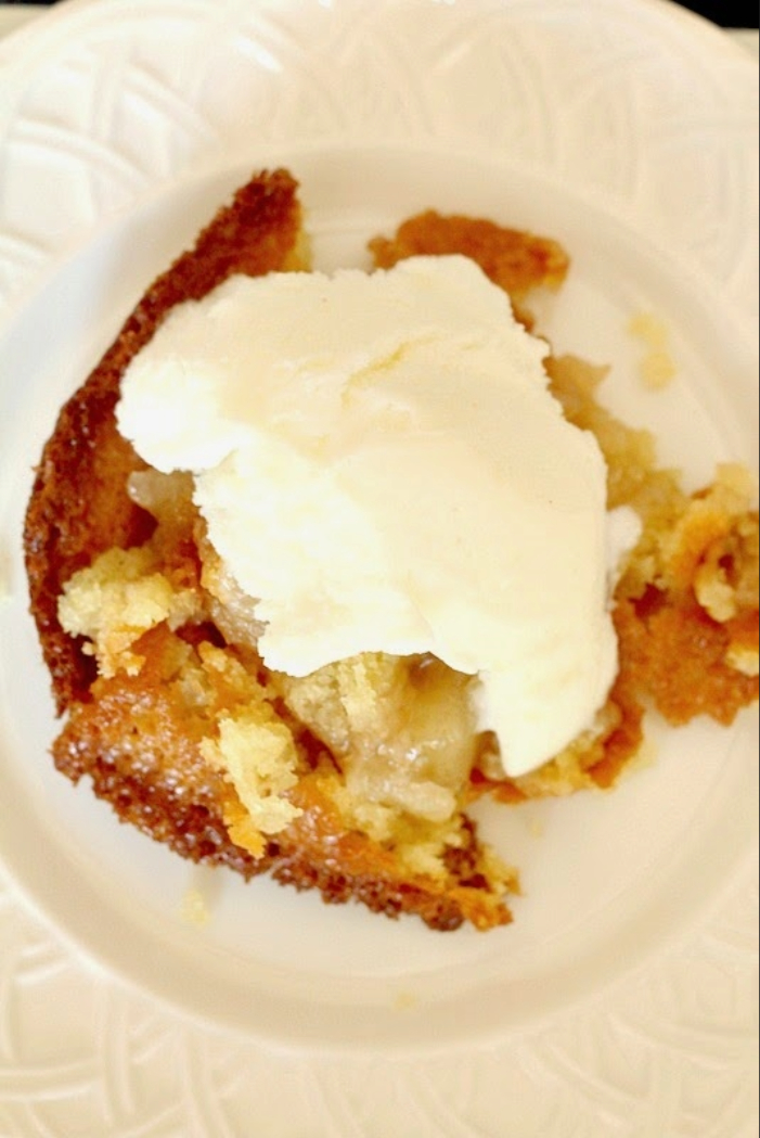 Homemade apple cobbler served warm with vanilla ice cream for a summer dessert.