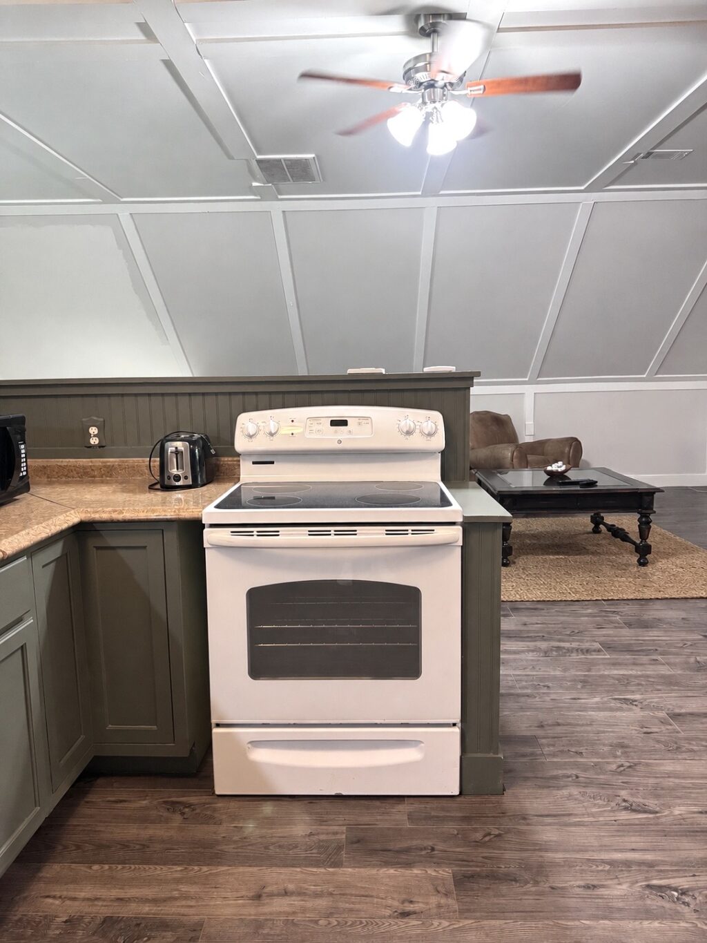 Cottage-inspired guest house kitchen with neutral decor