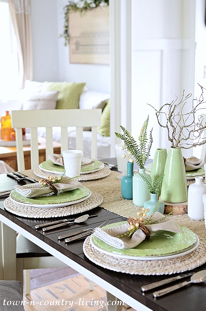 Simple summer table setting with green and natural accents